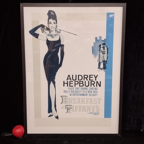 108 - A large print of Audrey Hepburn film poster featuring 'Breakfast at Tiffany's. Housed in a neat blac... 