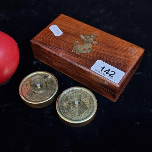 142 - A pair of nautical perpetual calender and world timer in a fitted wooden case with brass anchor inla... 