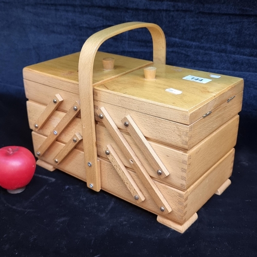 144 - A wooden accordion sewing storage box with 5 compartments.