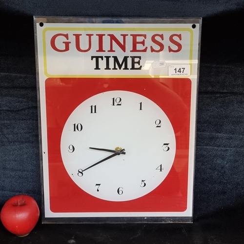 147 - An advertising wall clock for Guinness. Battery operated.