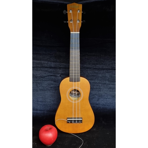 172 - A charming 'Vintage' branded ukulele housed in a nylon travel bag. RRP £44.99 on www.jhs.co.uk one s... 