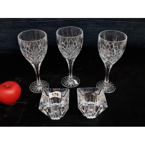 176 - Five elegant pieces of crystal including three Galway Crystal stemmed wine glasses and a pair of Tip... 