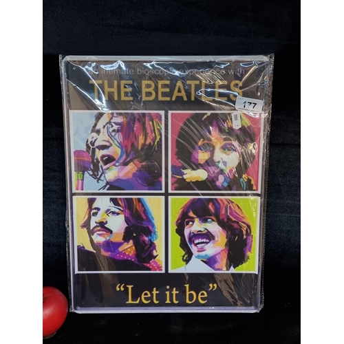 177 - A large printed metal wall sign in the form of a movie poster for The Beatles 
