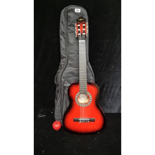 244 - An acoustic classical guitar,in Redburst, by Gear4Music. Comes with original tarvel case. RRP: £54.9... 