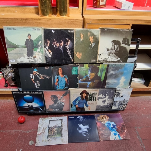 254 - A great selection of vinyl records including artists such as Rolling Stones x 2, Elton John, Billy J... 