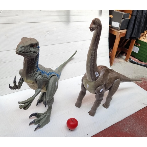 299 - Two large dinosaur toys, one T-Rex and one Diplodocus.