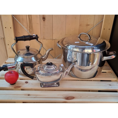 307 - A selection of household items including a large stainless steel pot along with a vintage electric M... 