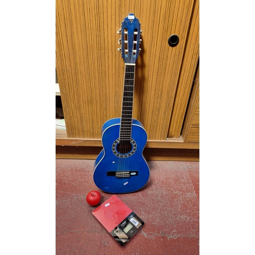 320 - A Valencia CG classic acoustic guitar in a nice bright blue colour RRP: €76.2 on musicsquare.eu, alo... 