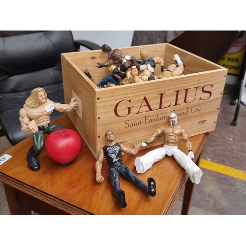 343 - A crate containing a large selection of WWE wrestling figures.