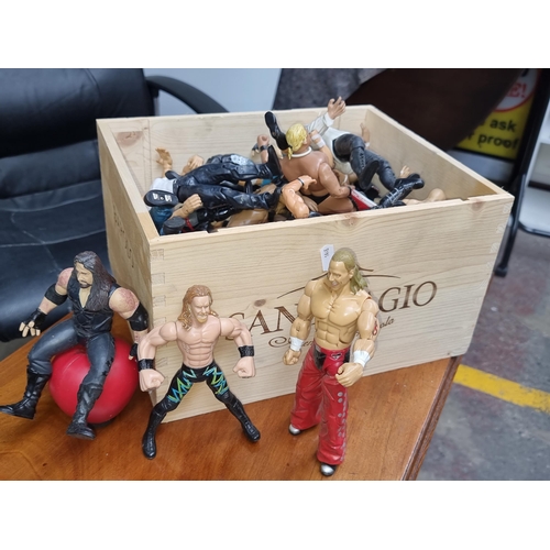 345 - A crate containing a large selection of WWE wrestling figures.