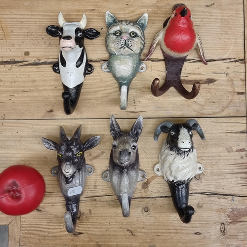 A selection of Six cast iron animal theme coat hooks including