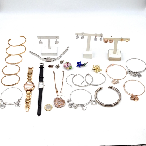 607 - A collection of costume jewellery and watches consisting of bracelets, earrings and brooches. Togeth... 