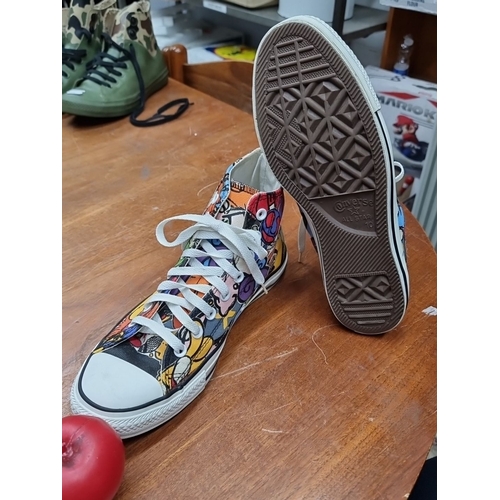 745 - A pair of brand new Converse All Star high-top sneakers in a graffiti print. UK size 10. Very cool.