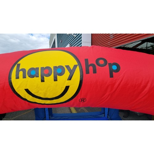 841 - A cheerful Happy Hop children's bouncy castle with slide, mesh sides and inclusive of air pump. Simi... 