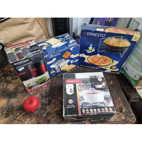 828 - Four boxes of household kitchen items including a Pizza baking set, mini chopper, Pasta machine and ... 