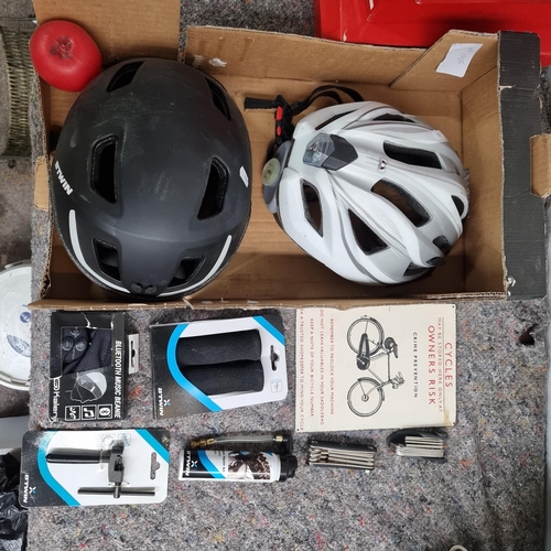 832 - A box of cycling items including two helmets, a Bluetooth music beanie and a Puncture repair kit and... 