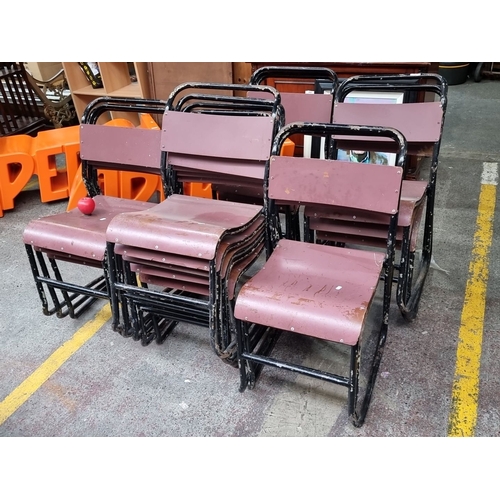 936 - Set of 16 vintage metal-framed stacking chairs with burgundy seat and backrest panels. Industrial st... 