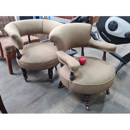 966 - Pair of Victorian walnut nursing chairs with scrolled arms and button-tufted upholstery. Featuring t... 