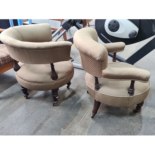 966 - Pair of Victorian walnut nursing chairs with scrolled arms and button-tufted upholstery. Featuring t... 