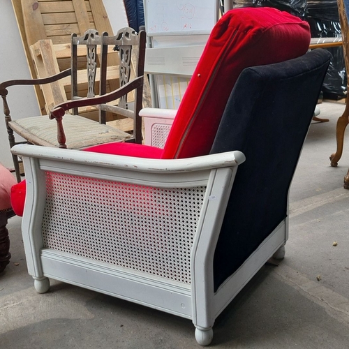 969 - Vintage white-painted armchair with red and black upholstery. Featuring stylish caned sides and back... 