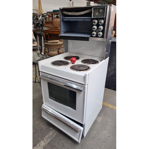 986 - A classic Vintage electric range with four coil burners, upper and lower ovens, and a control panel ... 