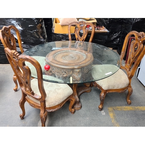 988 - Star lot...Round glass-top dining table with carved wooden base and four upholstered chairs. Elegant... 