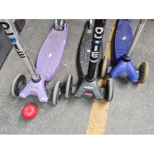 990 - Three Micro brand scooters, featuring tri-wheel design for stability. Includes two purple and one bl... 