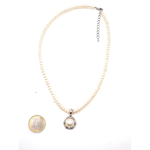 916 - A sterling silver pearl pendant drop necklace. Stamped 925. Lovely piece.