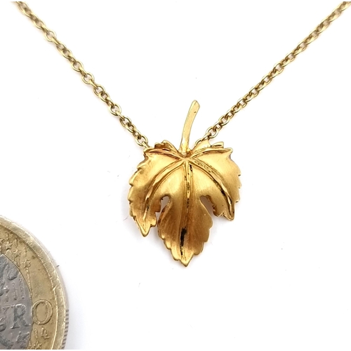 923 - A 9K gold leaf design pendant necklace with chain, length 38cm, weigh 1.95 grams, boxed.