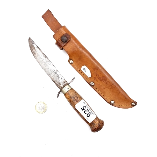 925 - A Swedish made hunting knife with polished wooden handle, length of knife 22cm, comes with Swedish l... 