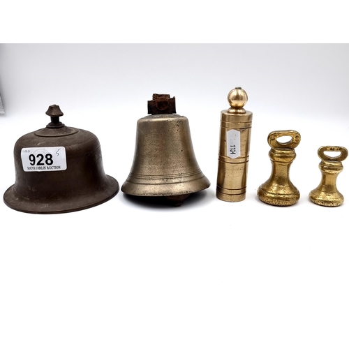 928 - Five antique brass items including weights and two shop bells.