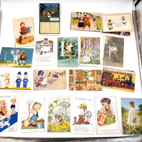 931 - A large quantity of beautiful early 20th century hand written postcards featuring characterful illus... 