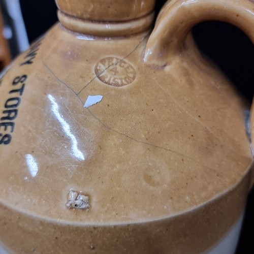 191 - A fantastic Junior Army & Navy Stores Ltd of D'Oliver Street Dublin stoneware flagon. In good order.... 