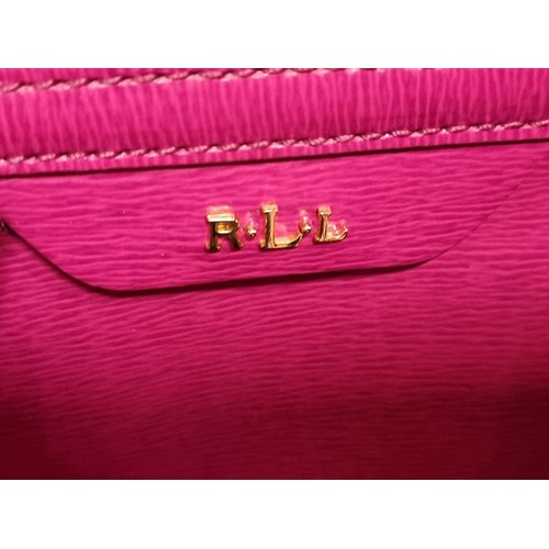 250 - A gorgeous designer Lauren by Ralph Lauren hand bag / cross body bag in a vibrant fuchsia pink. With... 