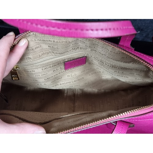 250 - A gorgeous designer Lauren by Ralph Lauren hand bag / cross body bag in a vibrant fuchsia pink. With... 