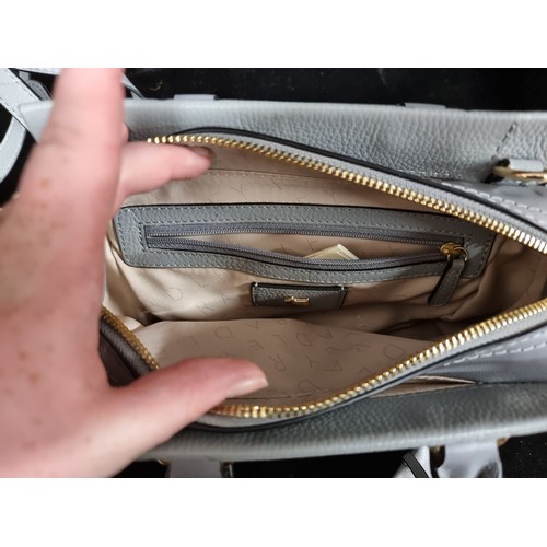 260 - A lovely Radley London ladies grey leather handbag. Comes with additional over the shoulder strap. R... 