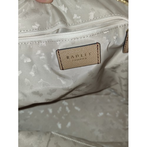 262 - A Radley London ladies tan leather handbag. RRP for similar models on website £199+ with original du... 