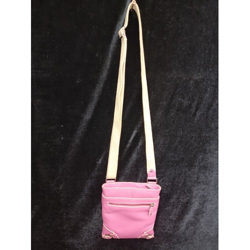 277 - A Jane Shilton genuine leather small crossbody messenger bag. Pink leather with a cream strap. In ve... 