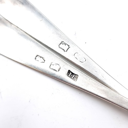 15 - Two bright cut Irish silver teaspoons (Marks indistinct) Length - 14 cms. Weight - 30.23 grams.