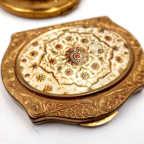 20 - A good collection of four vintage powder compacts set with enamelled and gem set detailing.(Includes... 