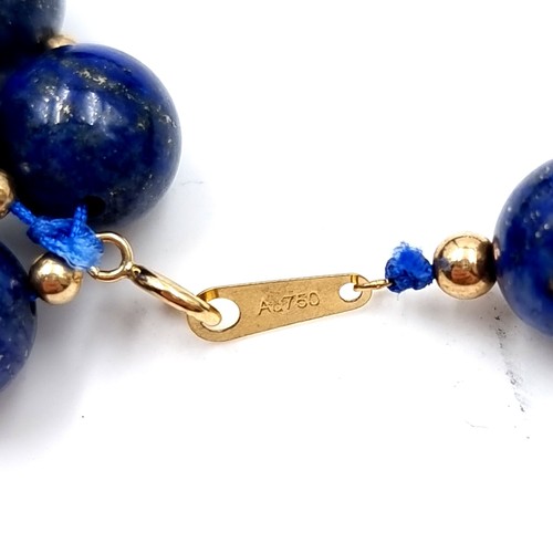 37 - Star Lot : An 18ct gold (marked 750 )  Lapis Lazuli necklace. Length - 50 cms. Weight - 46 grams. St... 