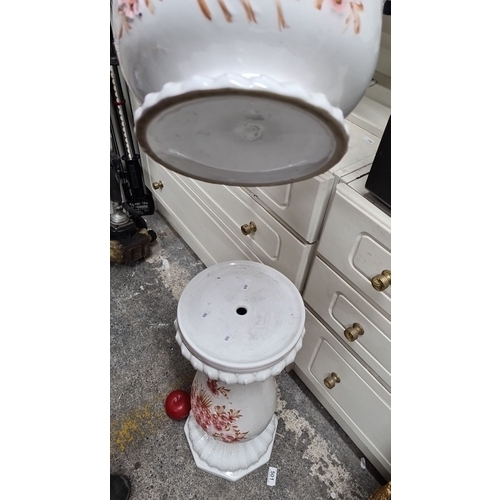 684 - A beautiful hand-painted ceramic planter and pedestal stand featuring floral motifs in pink and gold... 