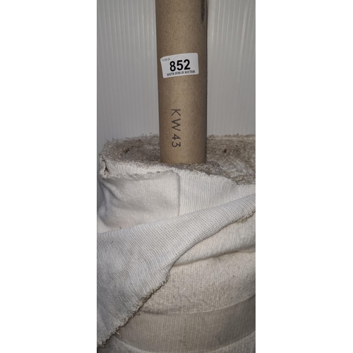 852 - A roll of white fabric for furniture reupholstery.