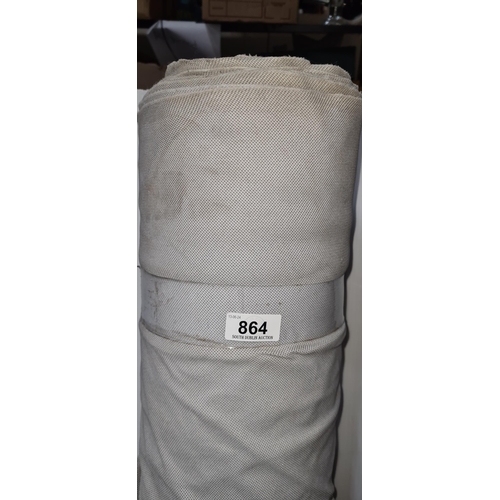 864 - A large roll of white fabric for furniture reupholstery.