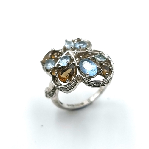 19 - A very unusual Aqua marine and smokey topaz  ring set in sterling silver wit a marcasite band going ... 