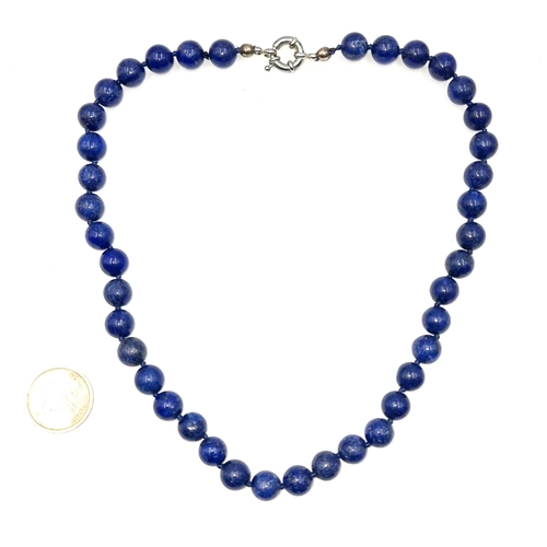 22 - A Lapis Lazuli necklace. Length - 44 cms. Weight - 72 grams. Stones cold to the touch.