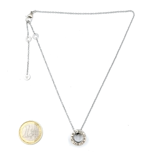 28 - A Bvlgari pendant with silver chain. Length - 40 cms. Weight - 8.34 grams.