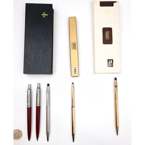 A collection of boxed pens consisting of two Parker ballpoint pens in original box. Together with a Cross ballpoint pen marked 12 carat rolled gold. Comes in original presentation box. Also two further Cross pens - one with brushed chrome finish and the other a 12 carat rolled gold example - Boxed. There is no additional opens in the boxes.