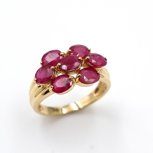 5 - A very fine example of a seven stone ruby ring set in nine carat gold. Weight - 3.5 grams. Size - O.... 