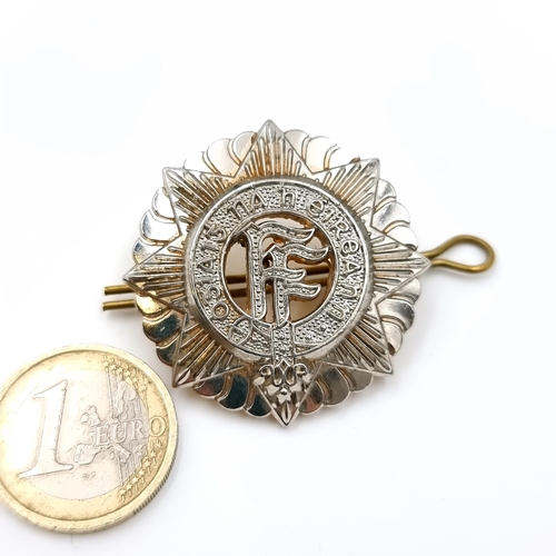 54 - An Irish Army cap badge. heavy good quality
